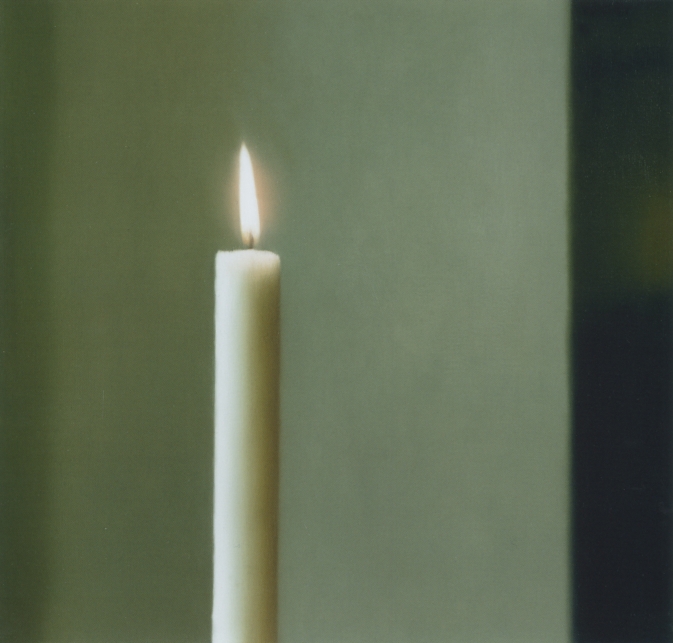 candle with white wall behind